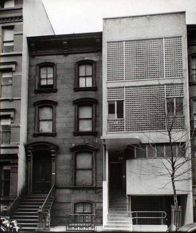 This view of East 48th Street shows the evolution of a city block. The building in the center of the frame has a brownstone front and is probably the oldest based on the material used and its height. It is surrounded by a brick-fronted and a glass-fronted building. Courtesy of the NYPL.